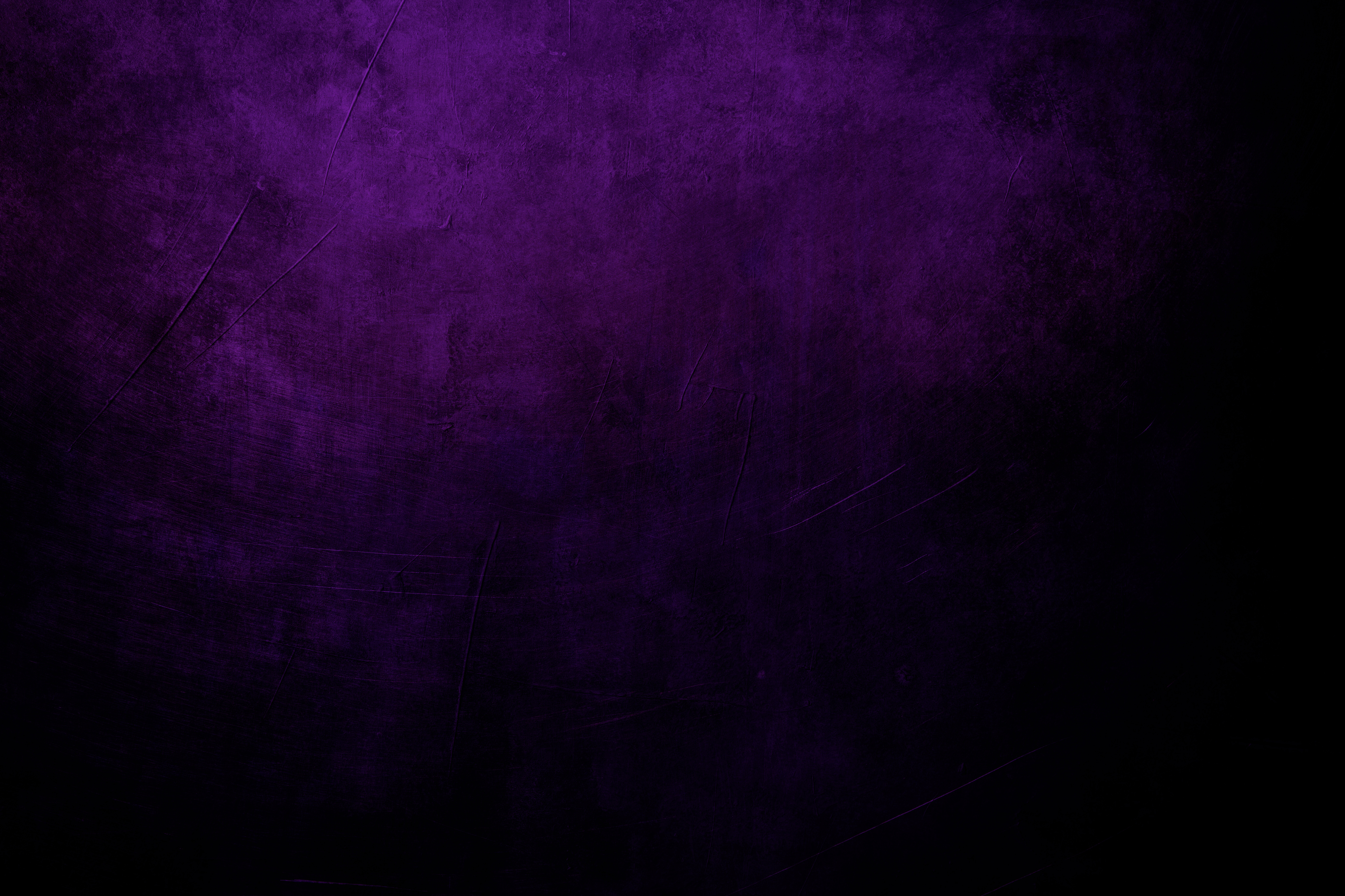 dark purple grungy background with spotlight background